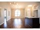 Open concept dining area with hardwood floors and large windows at 573 Hummingbird Ct, Kissimmee, FL 34759