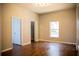 Bright bedroom with hardwood floors and a spacious closet at 573 Hummingbird Ct, Kissimmee, FL 34759