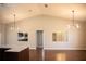 Bright dining room with hardwood floors and modern light fixtures at 573 Hummingbird Ct, Kissimmee, FL 34759