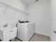 Laundry room with washer, dryer, and utility sink at 3120 Legends Preserve Dr, Daytona Beach, FL 32124