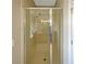 Bathroom with a shower stall and tiled walls at 15106 Ovation Dr, Winter Garden, FL 34787
