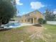 Two-story house with a covered patio and an inground pool at 15106 Ovation Dr, Winter Garden, FL 34787