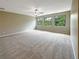Large bedroom with three windows and ceiling fan at 15106 Ovation Dr, Winter Garden, FL 34787