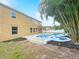 Back exterior of two-story house showcasing pool and patio area at 15106 Ovation Dr, Winter Garden, FL 34787