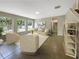 Bright living room with tiled floors, neutral walls, and ample natural light at 15106 Ovation Dr, Winter Garden, FL 34787
