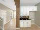 White kitchen cabinets and a breakfast bar at 15106 Ovation Dr, Winter Garden, FL 34787