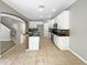 Kitchen with island, white cabinets, and a breakfast bar at 15106 Ovation Dr, Winter Garden, FL 34787