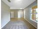 Living room with carpet and multiple entryways at 15106 Ovation Dr, Winter Garden, FL 34787