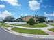 Two-story house with a well-manicured lawn and a white fence at 15106 Ovation Dr, Winter Garden, FL 34787
