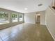 Spacious living room with tiled floors and large windows at 15106 Ovation Dr, Winter Garden, FL 34787