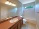 Bathroom with single vanity, tub, and toilet at 15106 Ovation Dr, Winter Garden, FL 34787