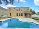 Two-story house with a pool and patio at 15106 Ovation Dr, Winter Garden, FL 34787