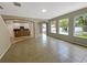 Gathering room with tile floors and pool view at 15106 Ovation Dr, Winter Garden, FL 34787