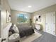 Bedroom with plush carpeting, a large window, and neutral decor at 15106 Ovation Dr, Winter Garden, FL 34787