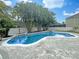 Inviting freeform pool with a paved patio and lush tropical landscaping at 15106 Ovation Dr, Winter Garden, FL 34787