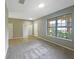 Living room with carpet, tile, and view of entryway at 15106 Ovation Dr, Winter Garden, FL 34787