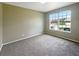 Bright bedroom with neutral walls and carpet at 15106 Ovation Dr, Winter Garden, FL 34787
