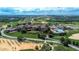 Aerial view of community with Tuscan style homes and golf course at 16828 Vinci Way, Montverde, FL 34756