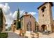 Tuscan-style building with stone facade and a courtyard at 16828 Vinci Way, Montverde, FL 34756