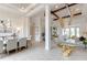 Open concept dining room and living room with high ceilings and modern light fixture at 16828 Vinci Way, Montverde, FL 34756