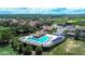Aerial view of resort-style pool with cabanas and lounge chairs at 16828 Vinci Way, Montverde, FL 34756
