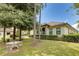 Charming backyard with a patio table and lush greenery at 16828 Vinci Way, Montverde, FL 34756