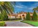 Luxury home with a beautiful landscaped yard and inviting entryway at 16828 Vinci Way, Montverde, FL 34756