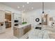 Large kitchen with granite countertops and an island at 16828 Vinci Way, Montverde, FL 34756
