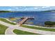 Private community dock with a wooden pier and paved walkway at 16828 Vinci Way, Montverde, FL 34756