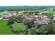 Aerial view of a large community clubhouse in a Tuscan style at 16828 Vinci Way, Montverde, FL 34756