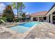 Inviting pool and spa surrounded by a large patio at 16828 Vinci Way, Montverde, FL 34756