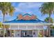Resort-style community pool with a shaded seating area at 4424 Kaipo Rd, Davenport, FL 33897