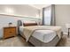 Spacious bedroom with a king-size bed and wood nightstand at 4424 Kaipo Rd, Davenport, FL 33897