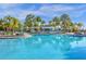 Large, refreshing community pool with plenty of lounge chairs at 4424 Kaipo Rd, Davenport, FL 33897