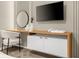 Modern vanity with wood top, mirror, and floating shelves at 4424 Kaipo Rd, Davenport, FL 33897