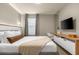 Bright bedroom with a king-size bed and built-in desk at 4424 Kaipo Rd, Davenport, FL 33897