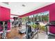 Fitness center with various equipment and pool view at 3211 Gold Ln, Kissimmee, FL 34747