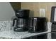 Black coffee maker and toaster on granite countertop at 3211 Gold Ln, Kissimmee, FL 34747