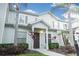 Two-story home with neutral siding, brown door, and landscaping at 3211 Gold Ln, Kissimmee, FL 34747