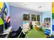 Game room with pool view, video games, and play area at 3211 Gold Ln, Kissimmee, FL 34747