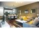 Living room with open floor plan, neutral decor, and a modern sofa at 3211 Gold Ln, Kissimmee, FL 34747
