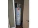 Close up view of a water heater and internet router in a closet at 3211 Gold Ln, Kissimmee, FL 34747