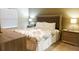 King-size bedroom with nightstands and neutral decor at 3211 Gold Ln, Kissimmee, FL 34747