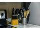 Granite countertop with organized cooking utensils and knives at 3211 Gold Ln, Kissimmee, FL 34747