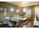 Open living room with dining area, hardwood floors, and neutral color palette at 3211 Gold Ln, Kissimmee, FL 34747