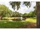 Serene pond with fountain and lush landscaping at 3211 Gold Ln, Kissimmee, FL 34747