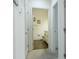 Clean bathroom with light wood cabinets and dark flooring at 3211 Gold Ln, Kissimmee, FL 34747