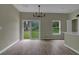 Bright dining room with sliding glass doors and chandelier at 556 Marion Oaks Pass, Ocala, FL 34473