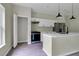 Modern kitchen with white cabinets, stainless steel appliances, and an island at 556 Marion Oaks Pass, Ocala, FL 34473