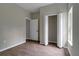 Bedroom with closet and door to hallway at 556 Marion Oaks Pass, Ocala, FL 34473